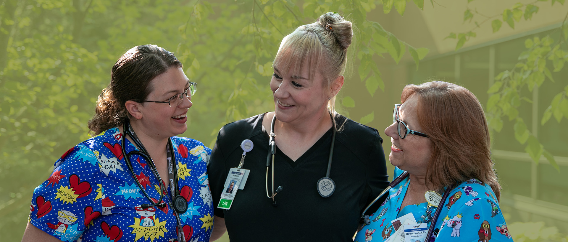 Three Licensed Practical Nurses Smiling and Looking at Each Other