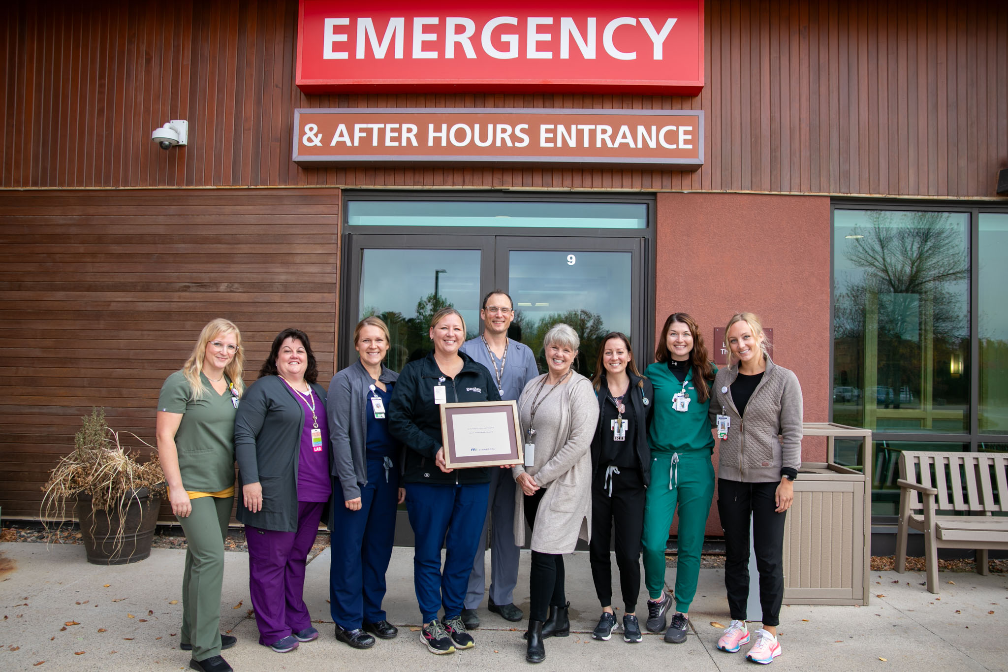 Grand Itasca Stroke Team posing in front of the Emergency Room entrance